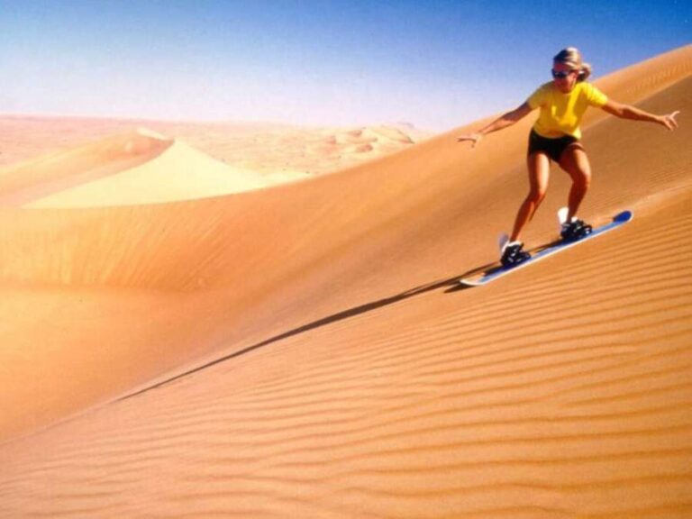 desert safari Dubai sandboarding