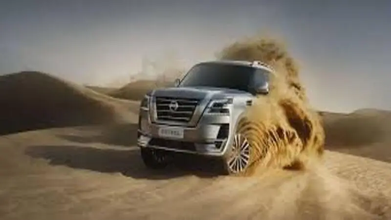Dune bashing in Dubai desert safari with sand dunes in the background
