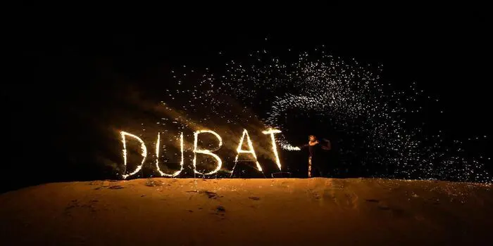 Desert safari adventure in Dubai with dune bashing, camel rides, and traditional desert camp experiences at sunset