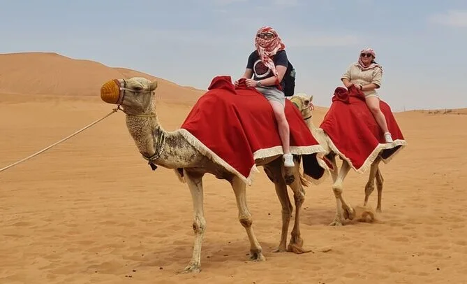 Affordable desert safari Dubai with dune bashing, camel rides, and BBQ dinner at sunset