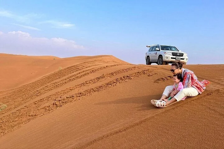 Cheapest desert safari in Dubai with free hotel transfers, dune bashing, camel ride, and BBQ dinner