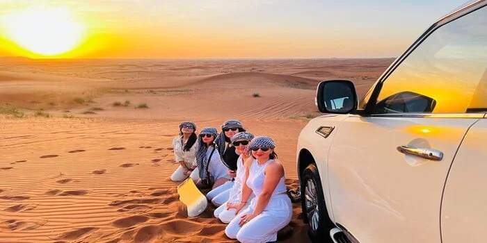 Desert safari Dubai experience during busy days with multiple 4x4 vehicles on red sand dunes