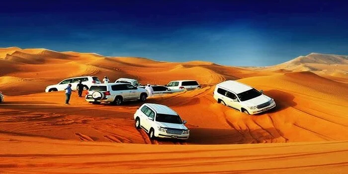 Desert safari Dubai guide showing dune bashing, camel ride and desert camp with prices and package details