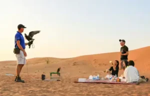 Morning desert safari in Dubai with sunrise dunes and breakfast setup in the Arabian desert
